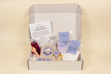 Open Unicorn Stardust Adventure potion kit showing bottles, powders, dried flowers, and story cards