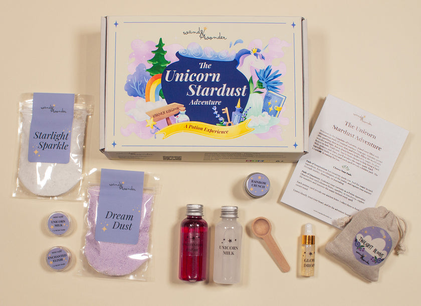 Unicorn Stardust Adventure potion kit by Wand & Wonder with box and magical ingredients laid out for imaginative science play